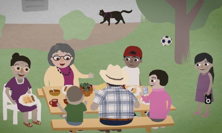 collage picture of a group of people seated around a picnic table sharing food with a cat walking across a fence, a soccer ball and a tree in the distance