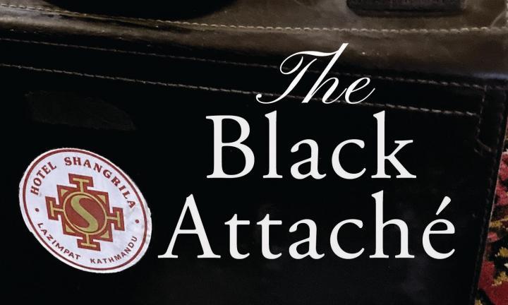 a black attaché with a white, red and gold Hotel Shangrila sticker