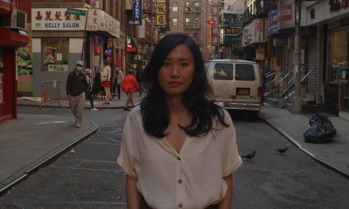 Author Jenny Xie standing in street of China Town