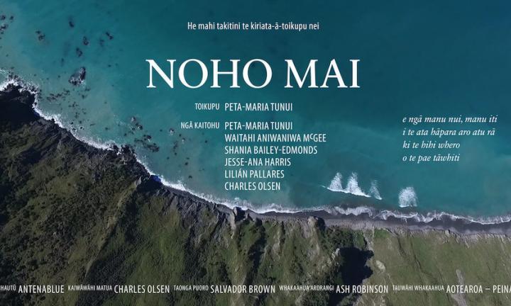 Noho Mai poster aerial shot of a shore with blue water