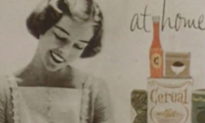 sepia toned ad from 50s smiling woman with bobbed hair wearing an apron with illustrations of catsup and cereal packages beside her