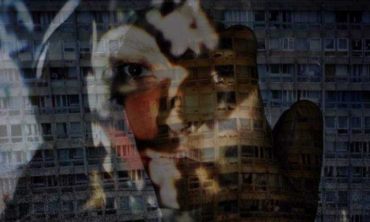 A woman's face superimposed over a building with many windows
