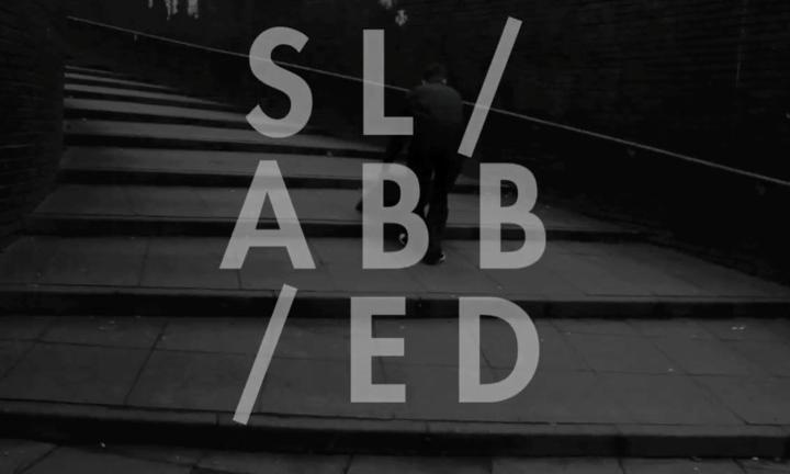 SLABBED letters against a black and white photo of winding steps