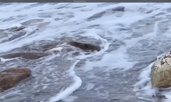 foaming shallow water with large rocks