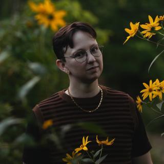 portrait of the author among yellow flowers