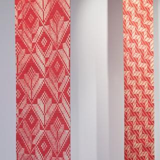 Red and white printed woven Whariki mats by Alexis Neal 