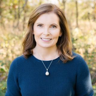 Portrait of the author. Forest background.