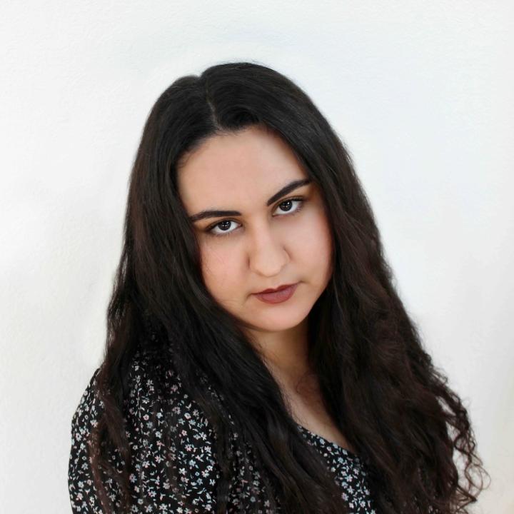 Amanda Rizkalla, a woman with long dark hair
