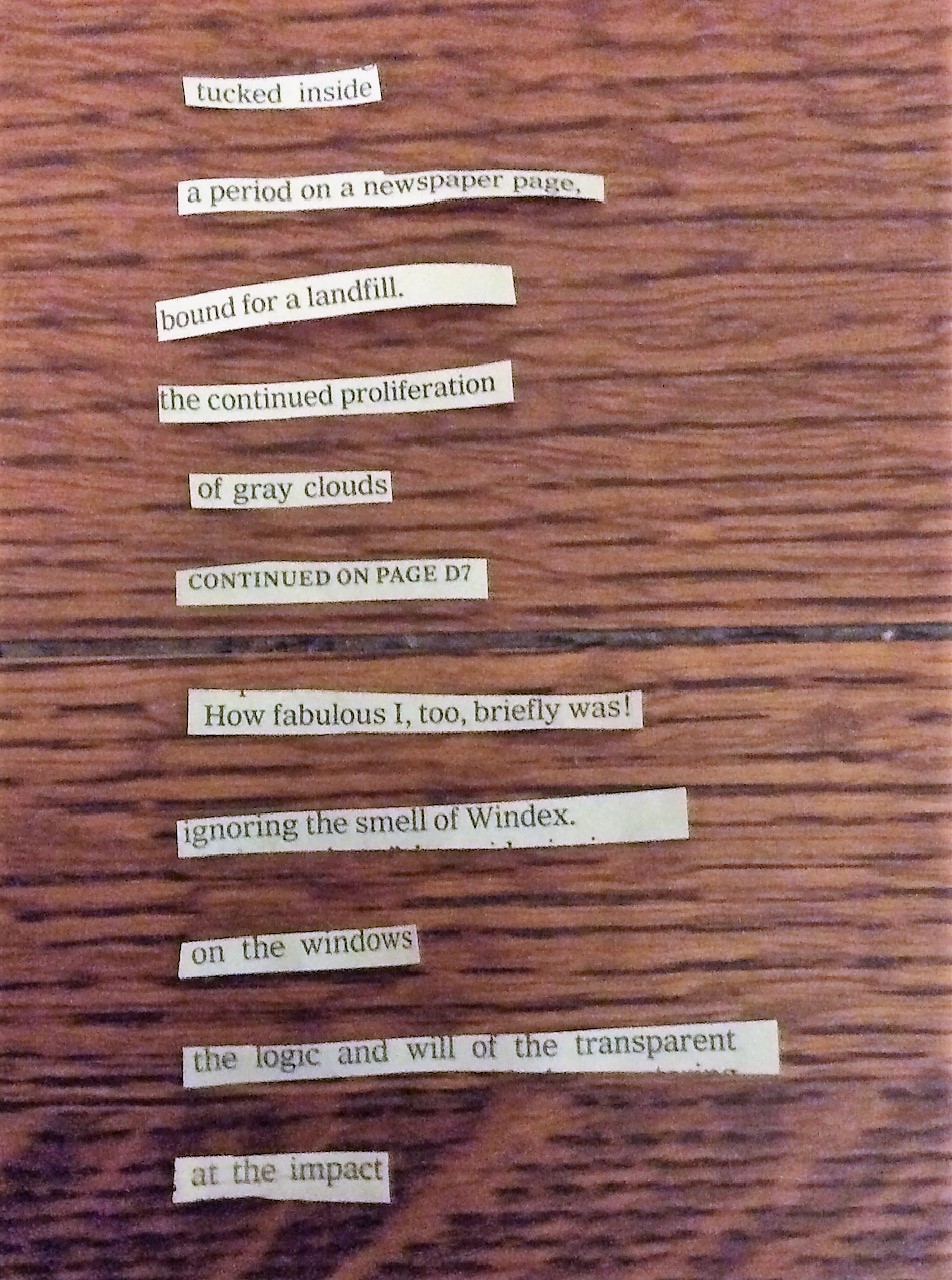 scraps of paper that make a poem on wooden background